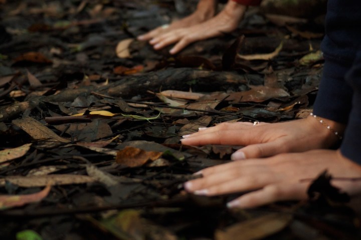 a group of people around each other