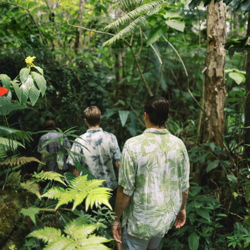 a couple of people that are standing in a garden