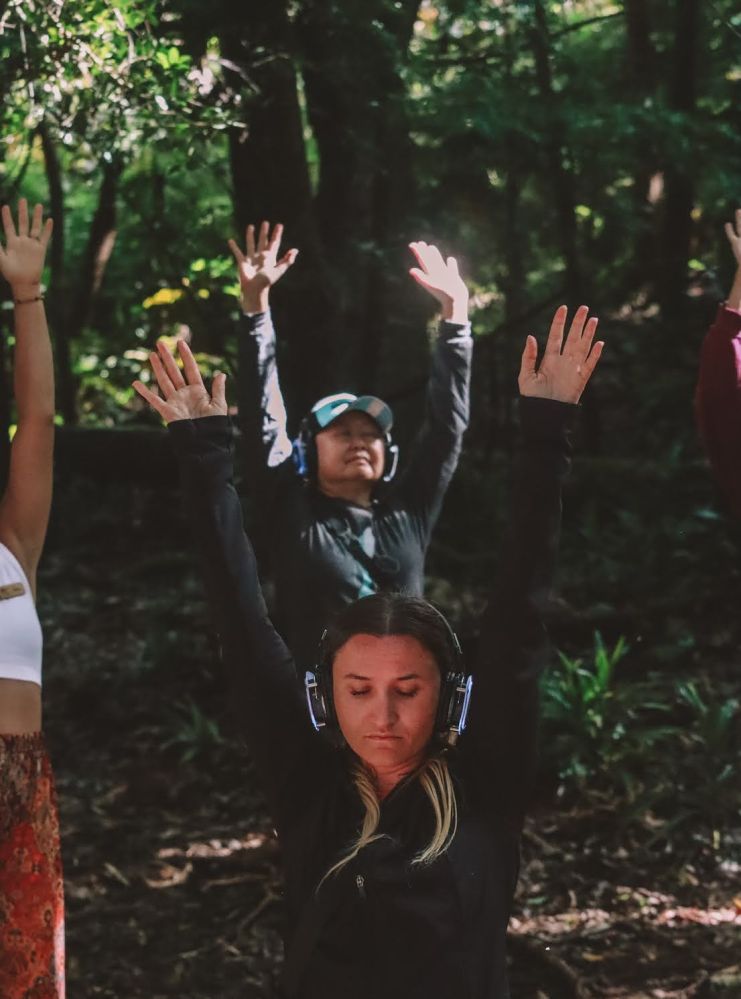 a group of people in a forest