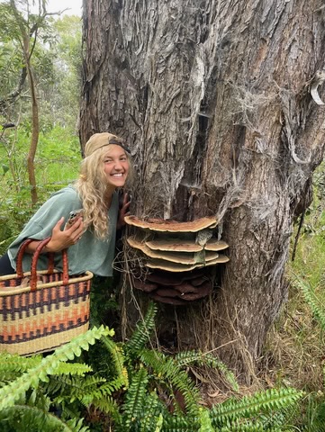 a person standing in front of a tree